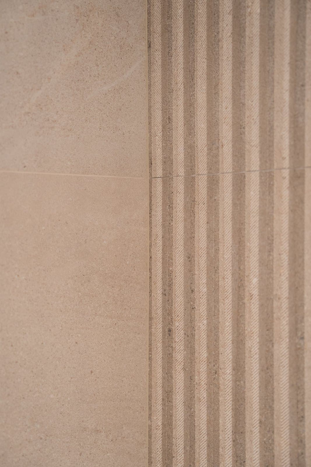 Fluted stone feature wall detail in a minimalist washroom