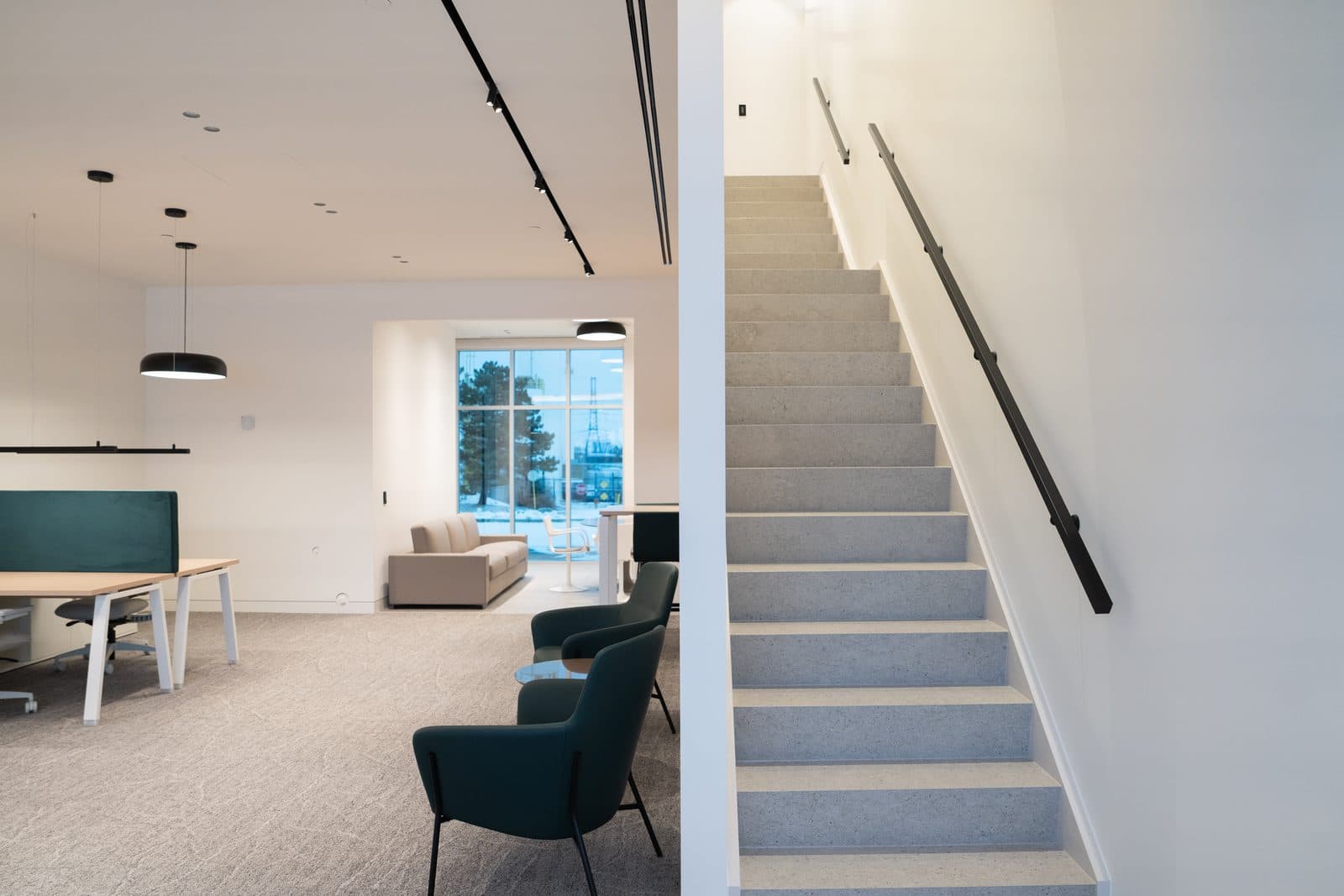 Open office and terrazzo staircase in a split composition