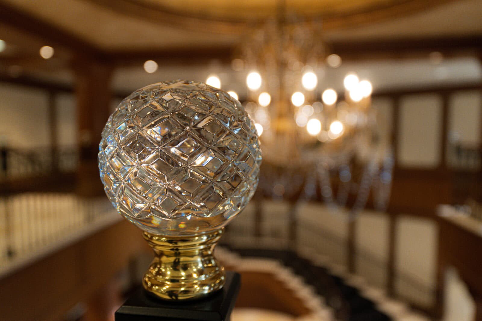 Crystal ball newel finial at the base of the stair